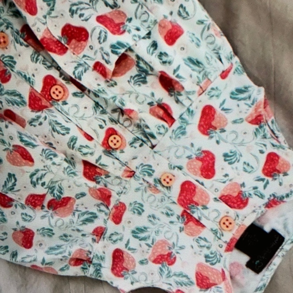 Vibrant strawberry pattern sleeveless blouse